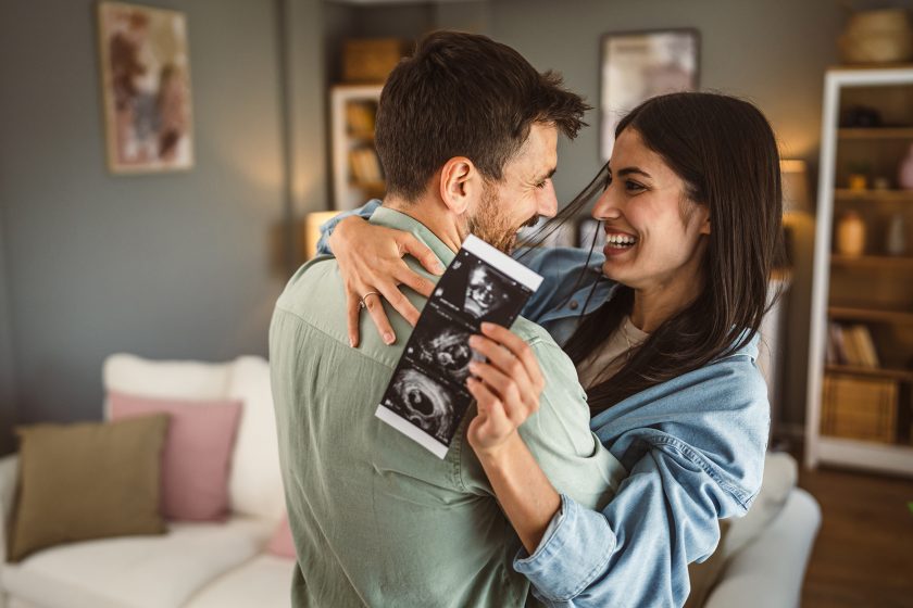 Resources 45 Happy pregnant woman with her partner and ultrasound photo